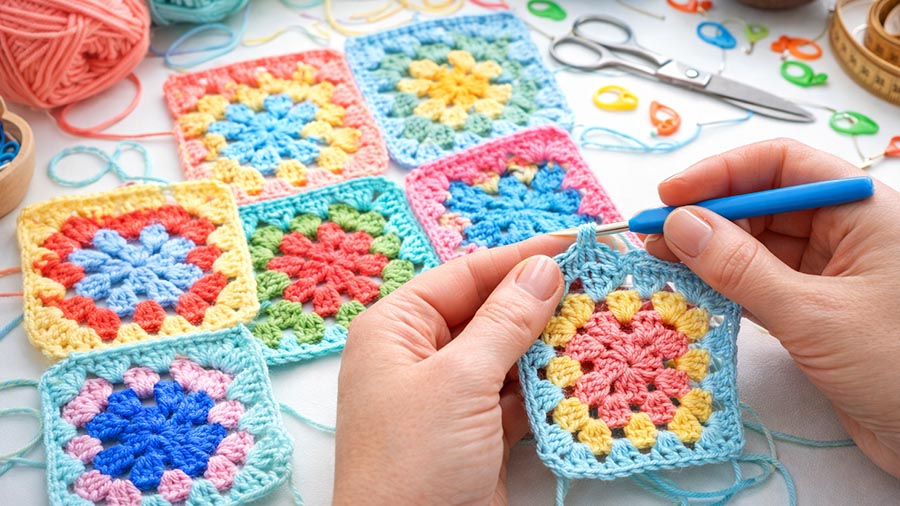 Yarn and crochet hooks arranged for an Elev8 Arts crochet class
