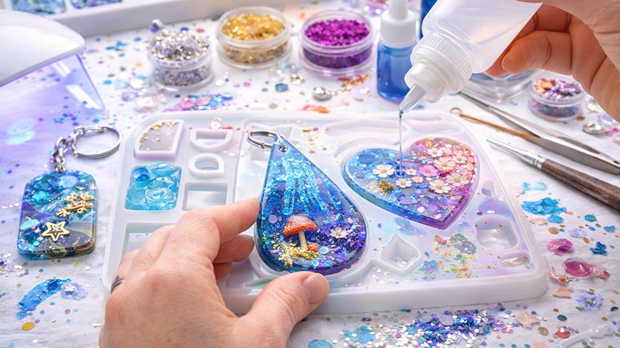 Resin art supplies and finished resin pieces for an Elev8 Arts class