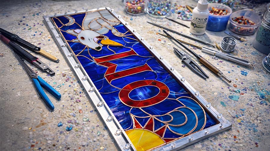 Colorful stained glass panel example for an Elev8 Arts class